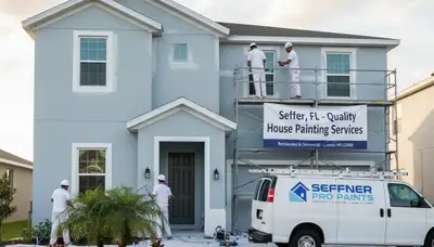 Professional house painters in Saint Petersburg FL refreshing home exterior with quality paint finish